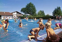 Children are playing in a pool   