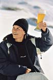 Woman with cap and glass of beer