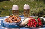 Table with food and beer outdoors - a proper Bavarian snack