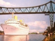 White cruise ship on the Kiel Canal near Rendsburg
