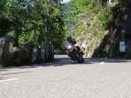 Motorcyclist on a mountain bend