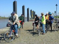 Cyclists by the waterside on the Marshes Route