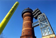 Brick tower and glass tower stand as testaments to the region's industrial history