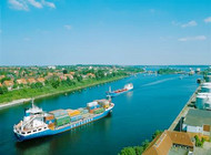 A freight ship carries its goods on the Northern Baltic Canal