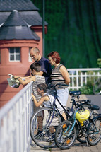 Family enjoying the view from a bridge over the Moselle