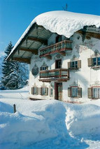 Snow-covered Bavarian house with its Lftl art