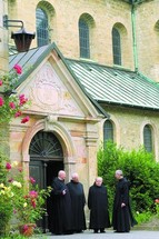 Benedictine monks outside an abbey