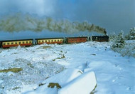 Brocken narrow gauge steam train in wintery landscape in the Harz nature reserve