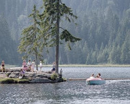 Family boating on a lake in the Bavarian Forest nature reserve