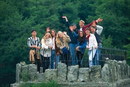 Walking group waving from a viewing point near the Externsteine natural monument