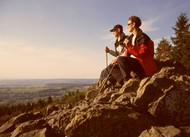 Two hikers taking a well-earned rest and enjoying the view