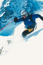 Skiing downhill in the deep snow