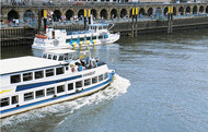 Two pleasure boats touring the harbour