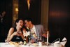 Couple in restaurant having a candlelit dinner