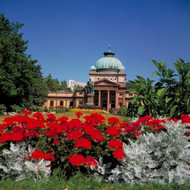 View of Kaiser Wilhelm Spa with flowers in the foreground