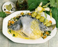 Carp au bleu on a bed of potatoes and vegetables
