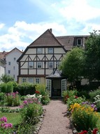 Bach's House in Eisenach with flowers in the front garden