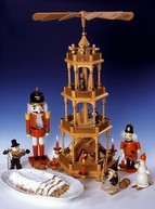 Christmas scene with nutcracker, pyramid and stollen