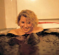 Woman in peat spa