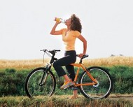 Cyclist having a refreshing break