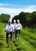 Four chefs on bicycles
